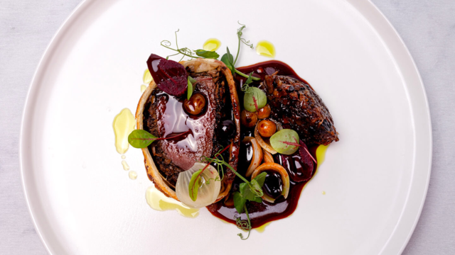 Wellington of venison with onion, game jus with beet, bay oil, salsa of pecan and black garlic